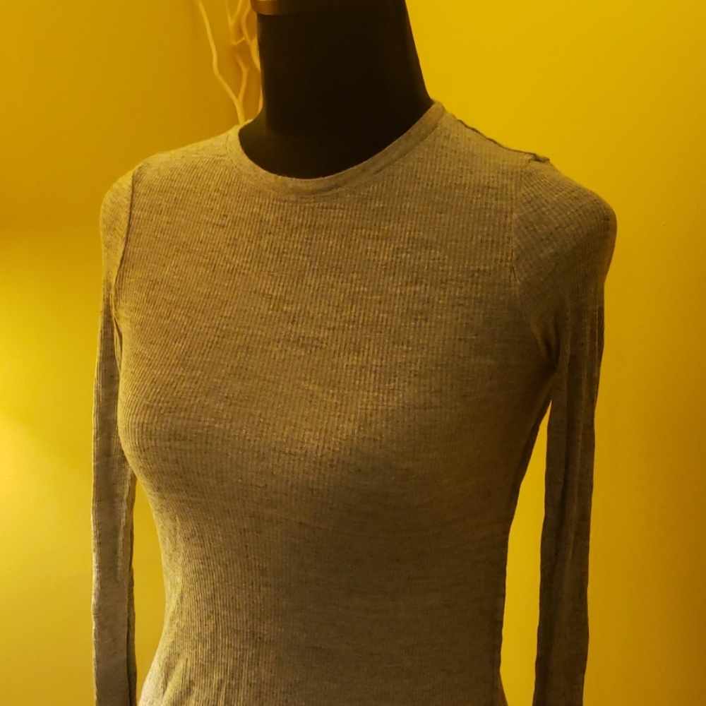 Long sleeve top, with split sides at the bottom.
